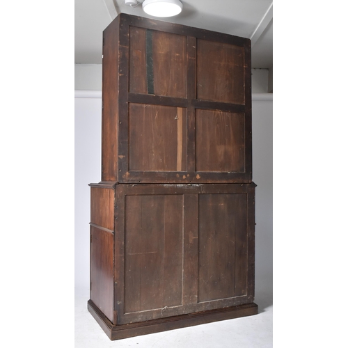 57 - A 19th century George III mahogany secretaire / estate bureau bookcase. Raised on a plinth base with... 