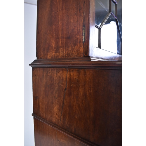 57 - A 19th century George III mahogany secretaire / estate bureau bookcase. Raised on a plinth base with... 