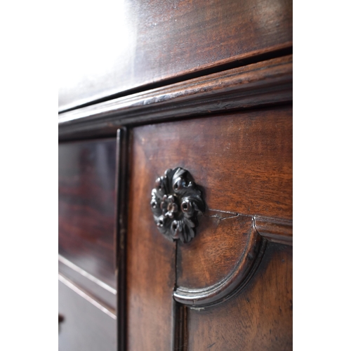 57 - A 19th century George III mahogany secretaire / estate bureau bookcase. Raised on a plinth base with... 