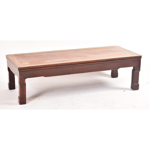 593 - A late 19th century Chinese hardwood low coffee table. The coffee table with panelled top and the le... 