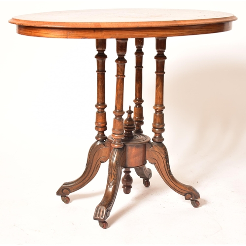 596 - A 19th century High Victorian walnut and marquetry inlaid oval side / hall table. The table being ra... 