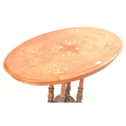 596 - A 19th century High Victorian walnut and marquetry inlaid oval side / hall table. The table being ra... 