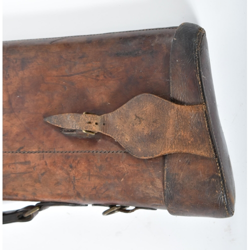 597 - Two late 19th century Victorian leather gun cases with brass fixtures. One marked to lock C. Martin.... 