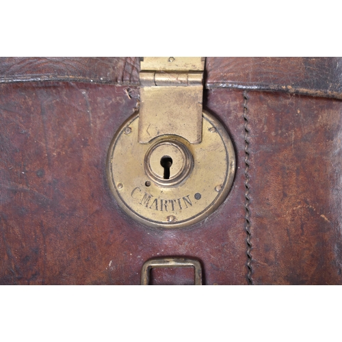 597 - Two late 19th century Victorian leather gun cases with brass fixtures. One marked to lock C. Martin.... 