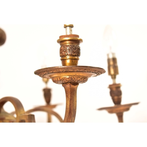 599 - A pair of 20th century Dutch style gilt brass chandelier / light fitting. The larger of the two havi... 