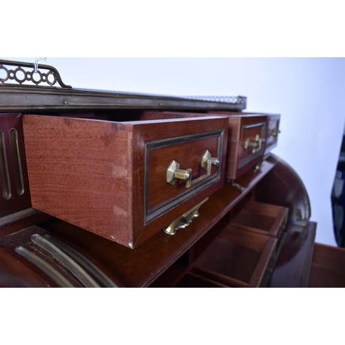 61 - A 19th century French empire mahogany and brass cylinder bureau desk. Raised on reeded tapering legs... 