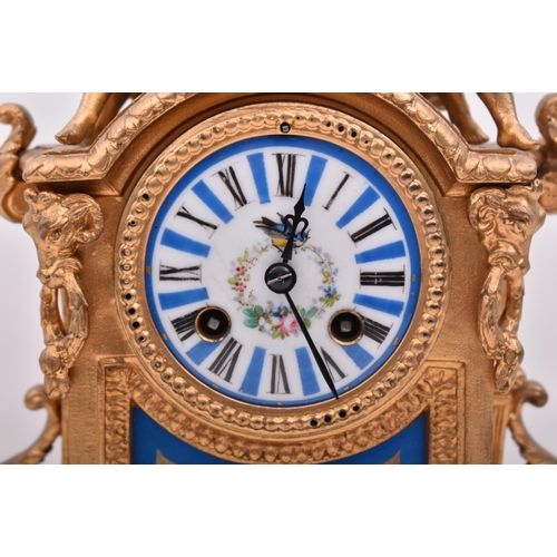 63 - A 19th century French gilt brass and enamel porcelain painted mantel clock. The cylinder head clock ... 