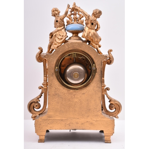 63 - A 19th century French gilt brass and enamel porcelain painted mantel clock. The cylinder head clock ... 