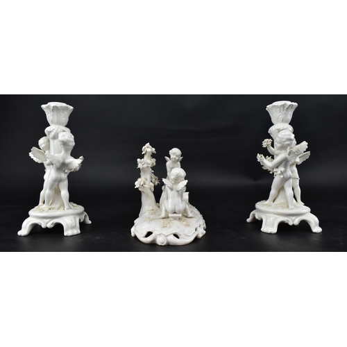 67 - A 19th century Triade PBB white porcelain glaze garniture - diorama of winged putti. The central put... 