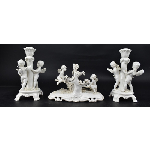 67 - A 19th century Triade PBB white porcelain glaze garniture - diorama of winged putti. The central put... 