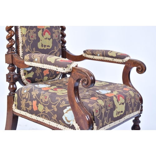 68 - A 19th century Victorian carved mahogany throne chair / armchair. Heavily carved top rail flanked by... 