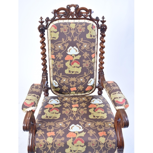 68 - A 19th century Victorian carved mahogany throne chair / armchair. Heavily carved top rail flanked by... 