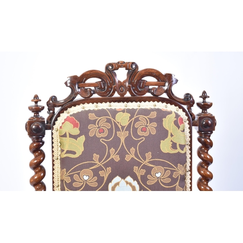 68 - A 19th century Victorian carved mahogany throne chair / armchair. Heavily carved top rail flanked by... 