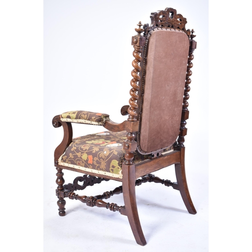 68 - A 19th century Victorian carved mahogany throne chair / armchair. Heavily carved top rail flanked by... 