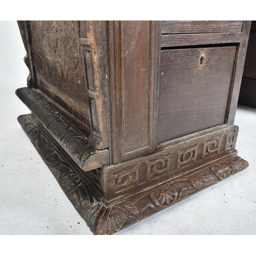 75 - A 17th century carved Italian large Cassone converted to a desk. The heavily carved front panel in r... 