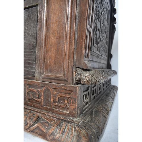 75 - A 17th century carved Italian large Cassone converted to a desk. The heavily carved front panel in r... 