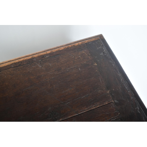 75 - A 17th century carved Italian large Cassone converted to a desk. The heavily carved front panel in r... 