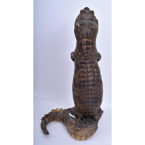 77 - A large early 20th century taxidermy crocodile / caiman in upright position for shop window advertis... 