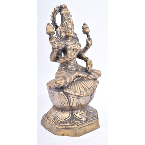 78 - An Indian heavy brass handmade Goddess Lakshmi/Laxmi statue modelled with 2 pairs of arms, one pair ... 