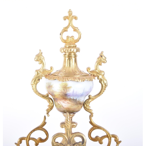 79 - A 19th century French gilt brass and enamel porcelain painted mantel clock. The cylinder head clock ... 