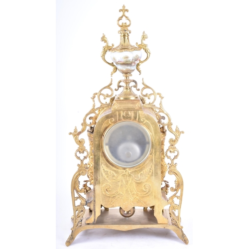 79 - A 19th century French gilt brass and enamel porcelain painted mantel clock. The cylinder head clock ... 