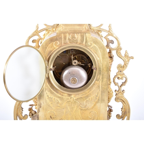 79 - A 19th century French gilt brass and enamel porcelain painted mantel clock. The cylinder head clock ... 