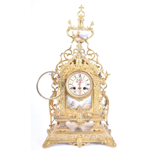 79 - A 19th century French gilt brass and enamel porcelain painted mantel clock. The cylinder head clock ... 