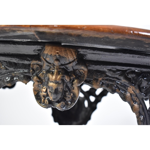 82 - A 19th century Victorian oak top cast iron pub / bistro table. The table of circular form with an oa... 