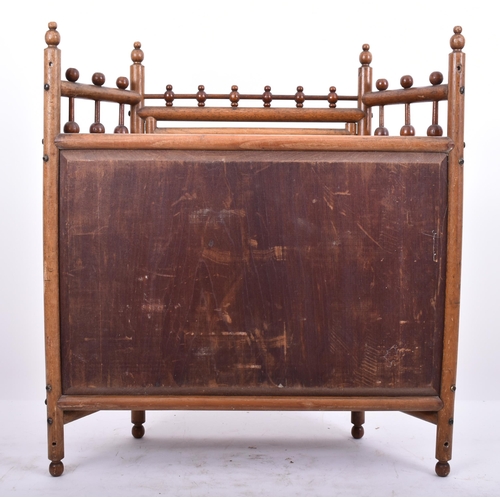 87 - A 19th century American oak stick and ball hanging display cabinet. The cabinet with stick and ball ... 