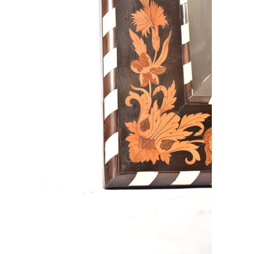 93 - A 19th century Dutch bone and ebony marquetry inlaid mirror. The mirror with bevelled plate and inla... 