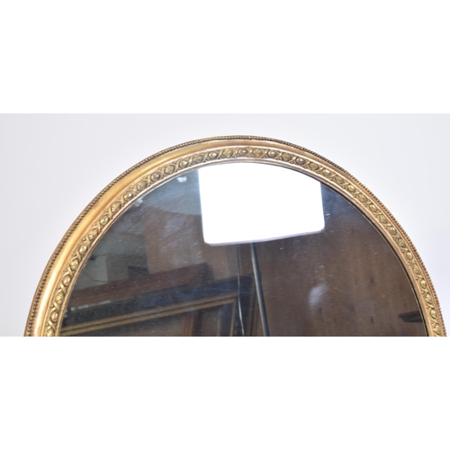 95 - A large late 19th century Victorian gilt framed mirror. The mirror of circular form with beaded edge... 