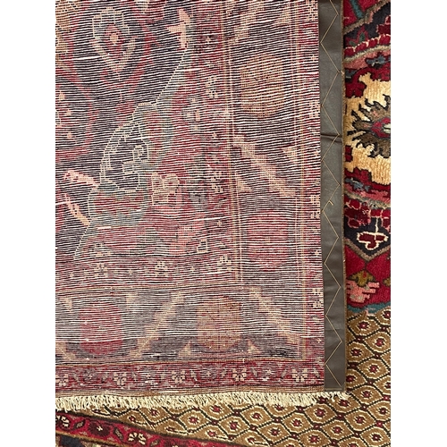 58 - An early 20th century North East Persian Islamic Kurdie floor carpet rug. The rug having a central f... 