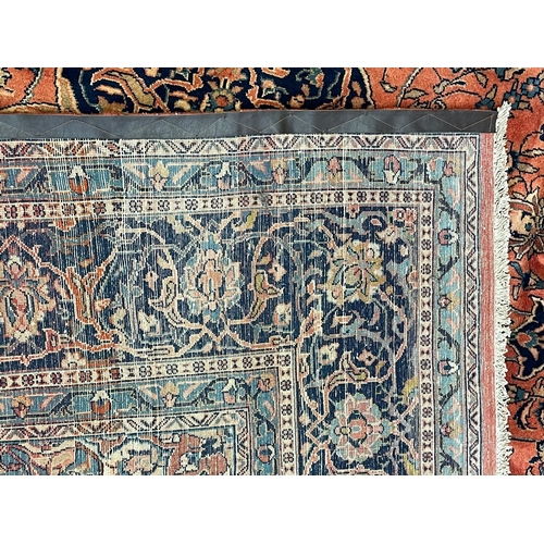 137 - An early 20th century North West Persian Islamic Sarouk floor carpet rug. The rug having a central f... 