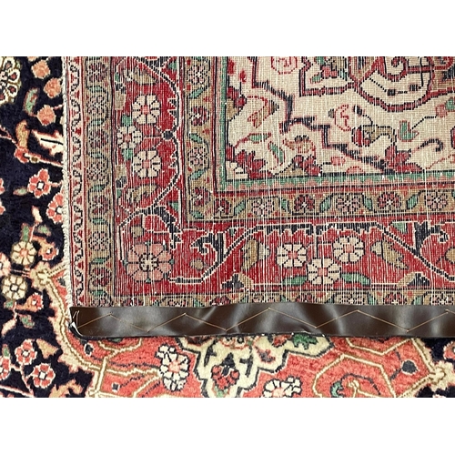 147 - An early 20th century North West Persian Islamic Sarouk carpet rug. The rug having a central blue me... 