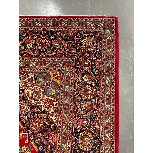 194 - An early 20th century Central Persian Islamic signed Kashan floor carpet rug. The rug having graduat... 