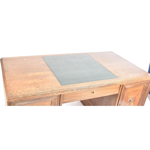 301 - An Art Deco early 20th century circa 1930s oak & leather top office writing desk table. The desk hav... 