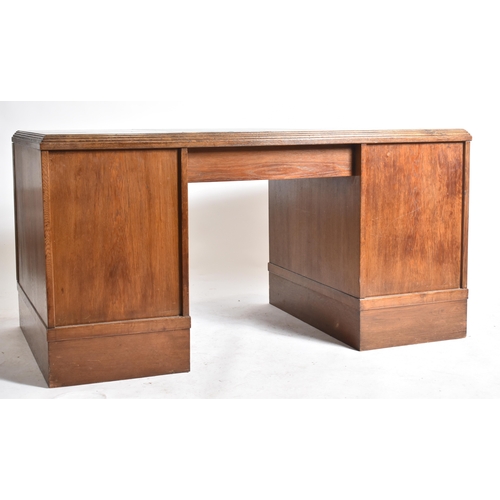 301 - An Art Deco early 20th century circa 1930s oak & leather top office writing desk table. The desk hav... 