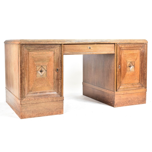 301 - An Art Deco early 20th century circa 1930s oak & leather top office writing desk table. The desk hav... 