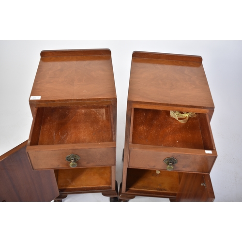 311 - A pair of Queen Anne revival walnut bedside cabinets. Each on stub cabriole legs with pad feet havin... 