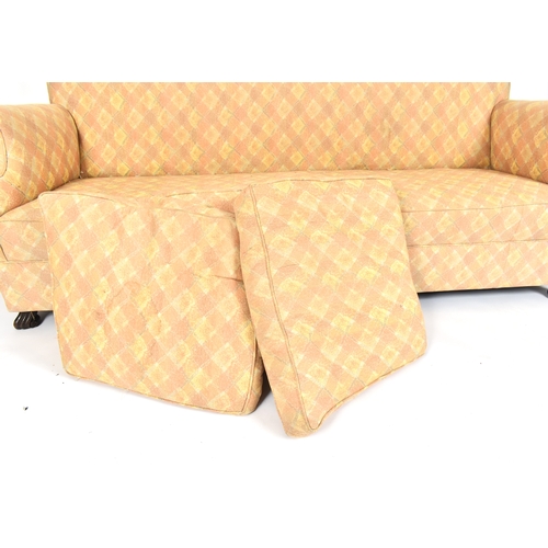 309 - An early 20th century circa 1930s Queen Anne revival Braganza feet upholstered three seater sofa. Th... 