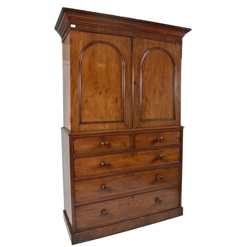 334 - A Victorian 19th century mahogany linen press cupboard. The press having a pediment top over double ... 