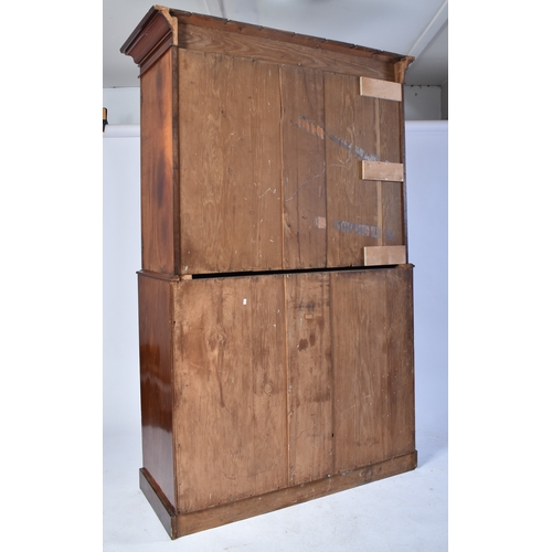 334 - A Victorian 19th century mahogany linen press cupboard. The press having a pediment top over double ... 