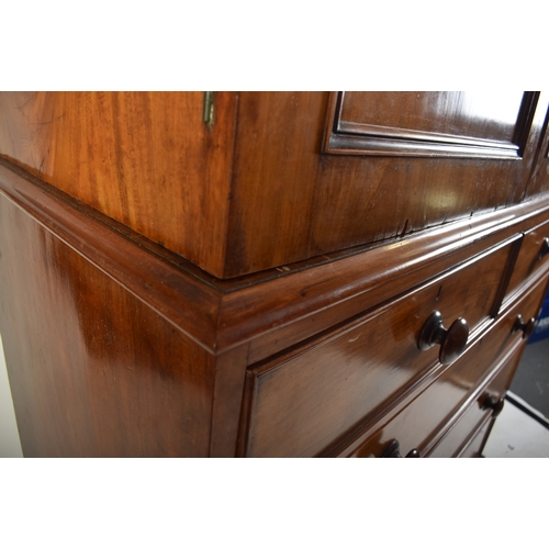 334 - A Victorian 19th century mahogany linen press cupboard. The press having a pediment top over double ... 