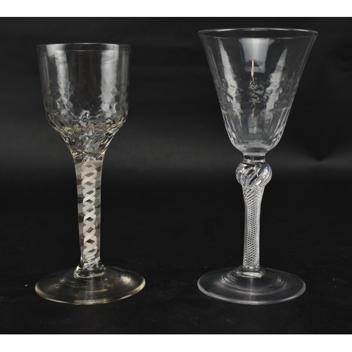 333 - Two 18th century wine glasses, each with a twist stem. One being a mid 18th century circa 1750 glass... 