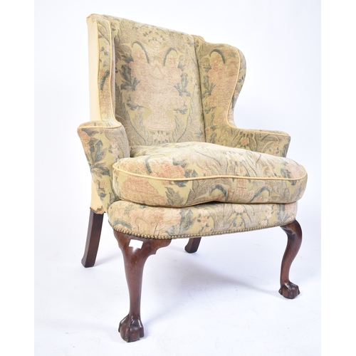 336 - A 19th century Queen Anne mahogany wingback armchair. Raised on cabriole legs with claw and ball fee... 