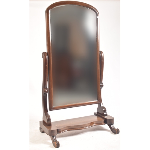 409 - A large Victorian 19th century mahogany cheval full length mirror. The mirror having a round curved ... 