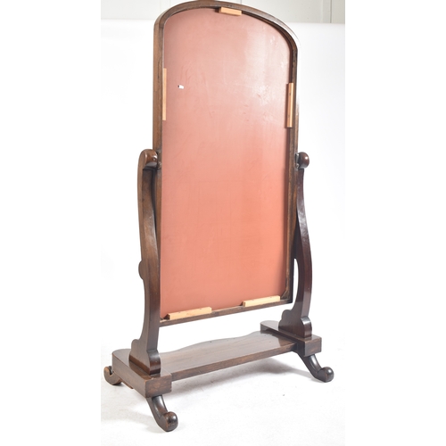 409 - A large Victorian 19th century mahogany cheval full length mirror. The mirror having a round curved ... 