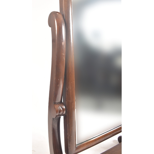 409 - A large Victorian 19th century mahogany cheval full length mirror. The mirror having a round curved ... 