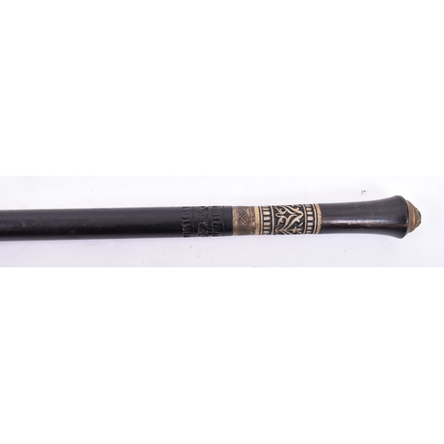 416 - An early 20th century Edwardian ebonised wood, bone and brass walking stick with brass handle moulde... 