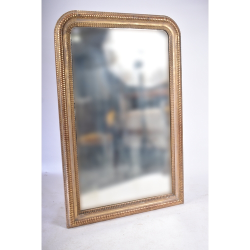 418 - A large 19th century Victorian giltwood mirror. The mirror of rectangular form with rope twist desig... 